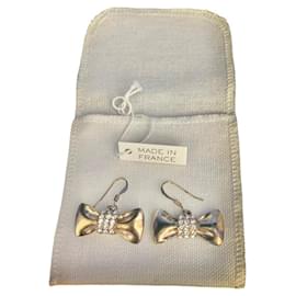 Orecchini a nodo Chloé ottone dorato e strass