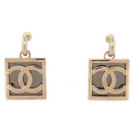 Orecchini pendenti Chanel in metallo dorato