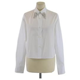 Camisa blanca de manga larga recortada con adornos de cristal de Prada