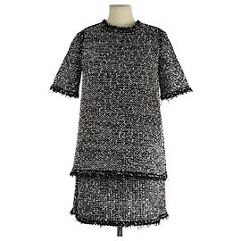 Conjunto de top de tweed lurex negro con flecos y mini falda Balenciaga