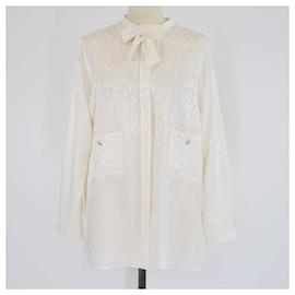 Blusa de manga larga en jacquard marfil con detalle de pajarita Chanel
