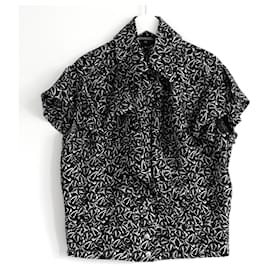 Blusa in seta con stampa di colomba e logo Chanel Resort 2022