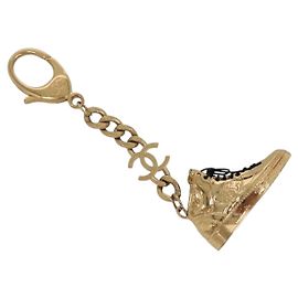 Portachiavi CHANEL in metallo dorato CC Auth 136338