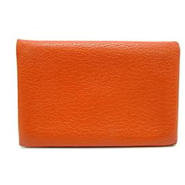 Porte-monnaie Calvi Hermès en cuir chèvre orange
