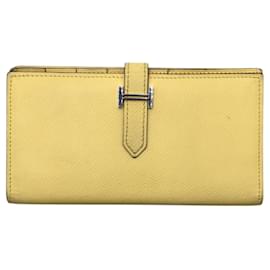 Portafoglio lungo giallo Hermès con hardware argentato