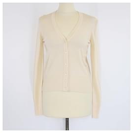 Top corto in lana lavorato a maglia con maniche lunghe e bottoni crema Alaia - Alaïa