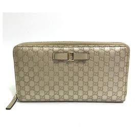 Cartera larga Guccissima en oro de Gucci
