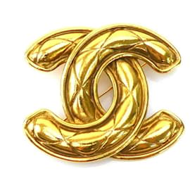 Spilla in metallo dorato Chanel
