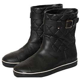 Botines planos Chanel de cuero acolchado negro blanco