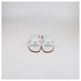 Sandali piatti Oran in pelle bianca Hermès