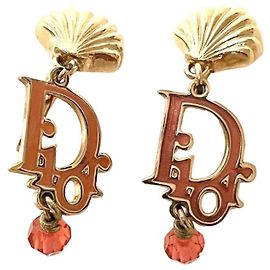 Orecchini in cristallo rosa rosso con logo dorato Christian Dior