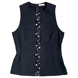 Blusa negra Thierry Mugler con detalles de perlas y encaje