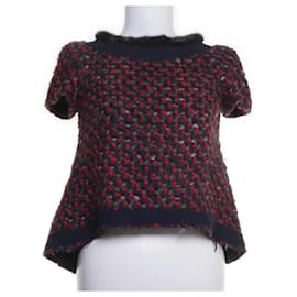 Blouse en laine Prada avec doublure en soie et bordure en vison