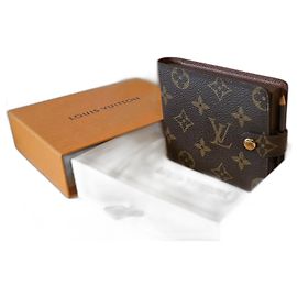Louis Vuitton Notizbuch und Bleistift.