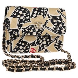 Portacarte Chanel a soffietto con catena in tela trapuntata stampata