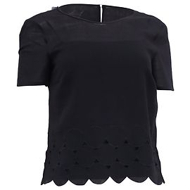 Blusa de Lana Negra Akris Punto con Corte Láser y Volantes