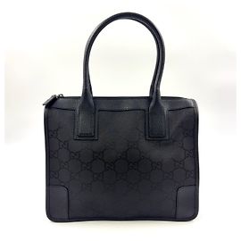 Borsa a mano in tela e pelle nera con motivo GG di GUCCI