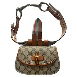 Gucci Bamboo 1947 mini riñonera marrón GG Supreme lona y cuero