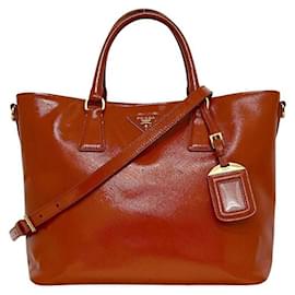Borsa a mano 2 in 1 in pelle verniciata arancione Prada