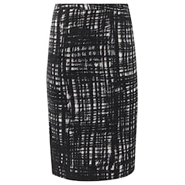 Falda lápiz midi de tweed negro de Michael Kors