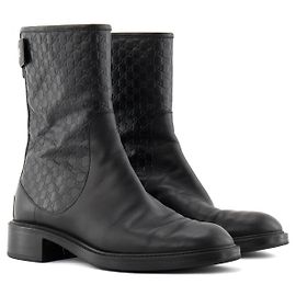 GUCCI - Stivaletti in pelle nera con monogramma in rilievo (Taglia 38.5)