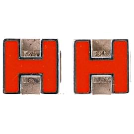 HERMÈS - Boucles d'oreilles Cage d'H Hermès en métal argenté et émail orange
