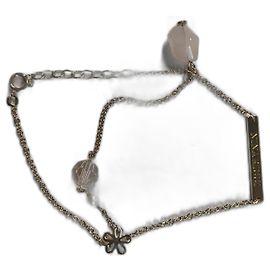 Nina Ricci Set aus 2 Armbändern Goldmetall und Kordel