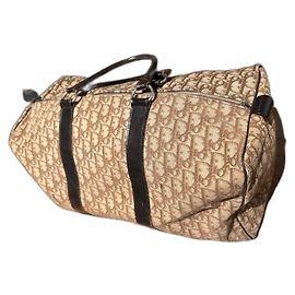Sac de voyage Christian Dior beige en toile et cuir