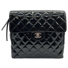 Zaino vintage in pelle verniciata nera trapuntata degli anni '90 di Chanel