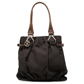 Céline Vertikaler Tote aus Macadam-Leinwand mit braunem, geprägtem Lederbesatz von Celine