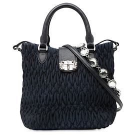 Borsa a mano in denim matelassé blu con cristalli Miu Miu