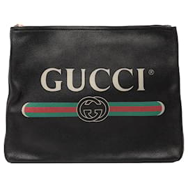 Clutch in pelle nera media con logo Gucci