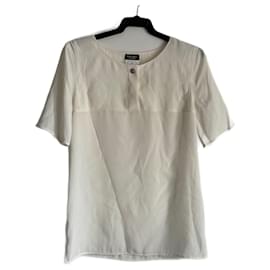 Blusa Chanel beige con detalle de magnolia