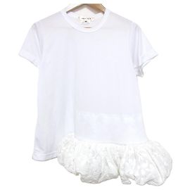 Autre Marque COMME des GARCONS Spitzen-Peplum-Top mit kurzen Ärmeln