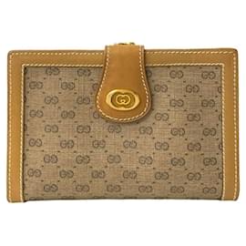 Billetera bifold de cuero marrón Gucci