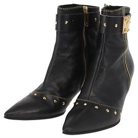 Botas Cortas LOUIS VUITTON de Cuero Suhari 34 1/2 Negro Oro LV Auth 143282