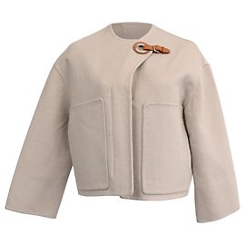 Chaqueta Hermès con detalle de hebilla en cachemira beige