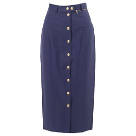 Falda azul Gucci de Tom Ford con botones dorados en la parte frontal