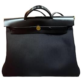 Hermès ZIP Schwarze Leinwand Gold Erbag