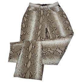 Pantalones de lona con estampado de serpiente vintage Versace dorados
