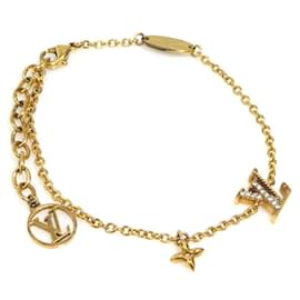 Bracciale in metallo dorato iconico LV di Louis Vuitton