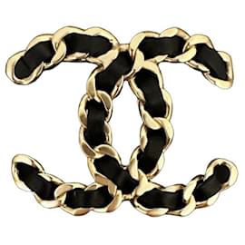 Broche Chanel de cuero trenzado