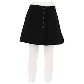 Gonna corta in lana nera con bottoni Alaïa