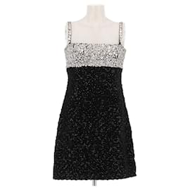 Vestido Andrew GN de tweed negro con inserciones de cuero