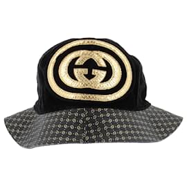 Cappello bucket Gucci nero e oro