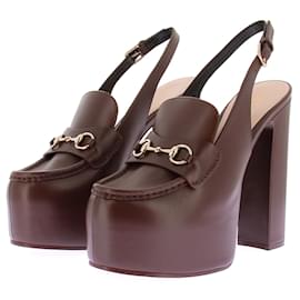 Gucci Mule con tacco e piattaforme "Horsebit"