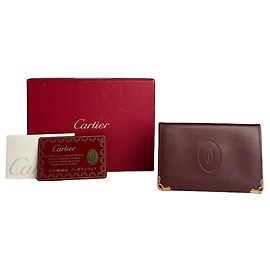 Porta tarjetas de cuero vintage Cartier con logo burdeos