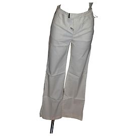 Pantalones blancos elásticos Moschino de viscosa