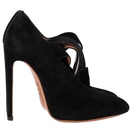 Pumps con cinturino a fibbia Alaïa in suede nero