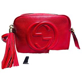 Gucci Bolso cruzado disco con borlas doradas Soho